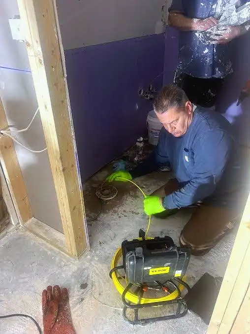Joe running a sewer camera