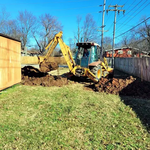 Backhoe excavating a water line